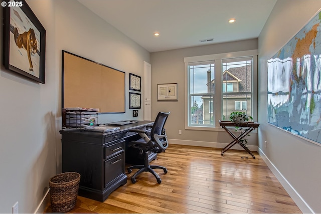 office with recessed lighting, baseboards, visible vents, and light wood-style floors