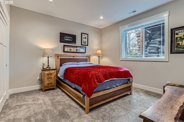 carpeted bedroom with baseboards, visible vents, and recessed lighting