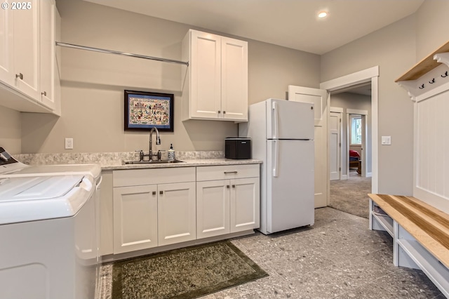 1543 SW Walters Loop, Gresham, OR 97080 - laundry area featuring a sink, washer / dryer, recessed lighting, and baseboards
