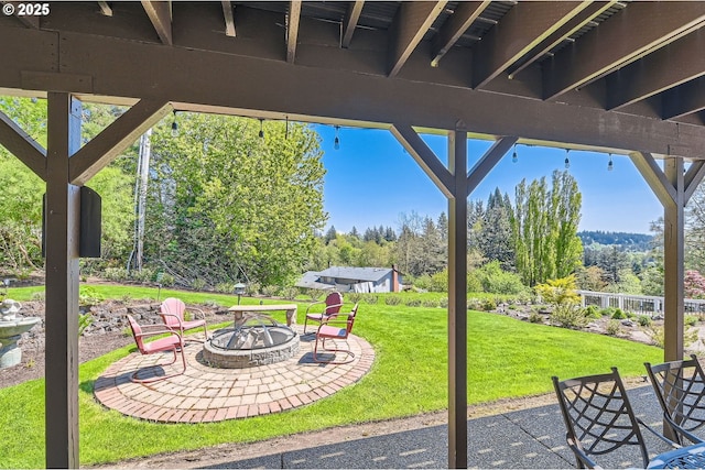 view of patio with a fire pit
