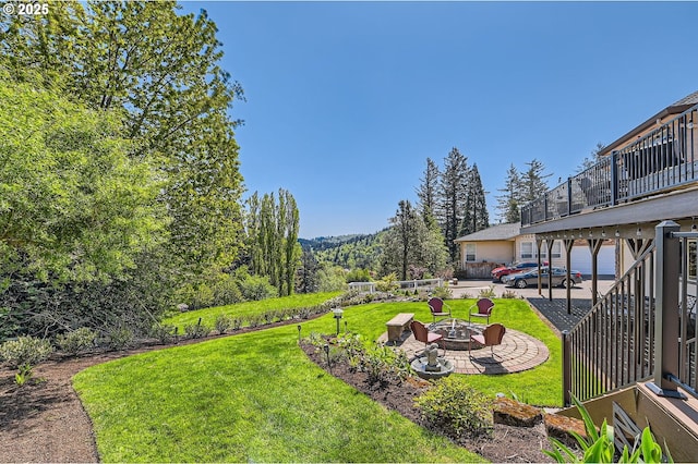 view of yard featuring a fire pit and a patio area