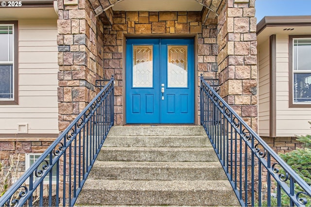 entrance to property with stone siding