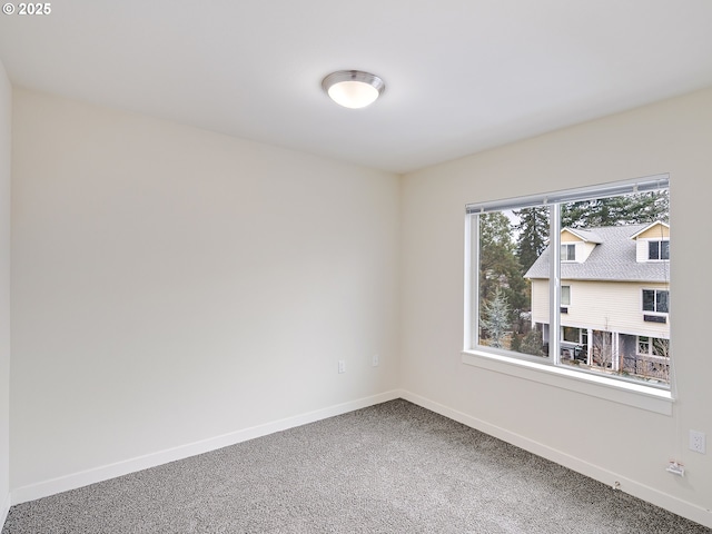 10829 E Burnside St, Portland, OR 97216 - carpeted spare room featuring baseboards