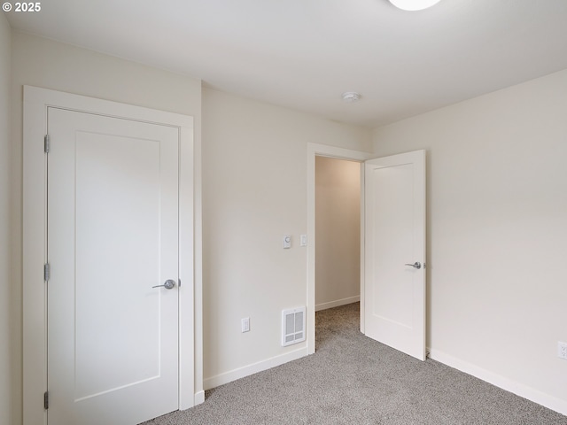 10829 E Burnside St, Portland, OR 97216 - unfurnished bedroom featuring carpet flooring and baseboards