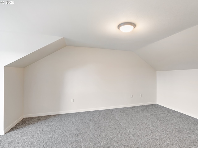 10829 E Burnside St, Portland, OR 97216 - additional living space featuring vaulted ceiling, carpet floors, and baseboards
