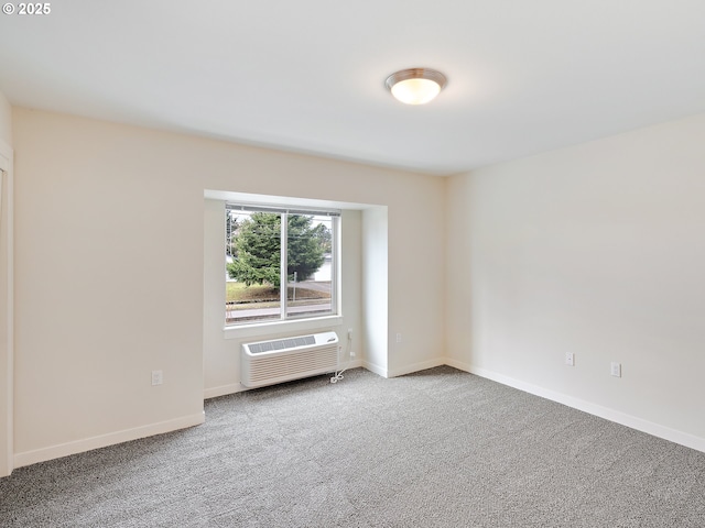 10829 E Burnside St, Portland, OR 97216 - carpeted spare room with a wall unit AC and baseboards