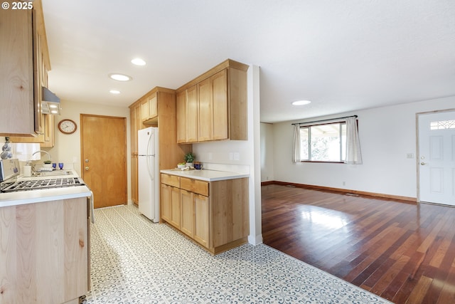 7430 N Burr Ave, Portland, OR 97203 - kitchen with white appliances, light brown cabinetry, under cabinet range hood, light countertops, and recessed lighting