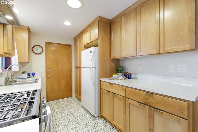7430 N Burr Ave, Portland, OR 97203 - kitchen featuring freestanding refrigerator, a sink, light floors, light countertops, and light brown cabinets