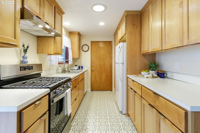 7430 N Burr Ave, Portland, OR 97203 - kitchen featuring white appliances, a sink, under cabinet range hood, light floors, and light countertops