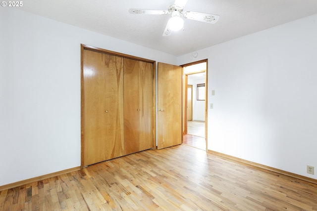 7430 N Burr Ave, Portland, OR 97203 - unfurnished bedroom with light wood finished floors, baseboards, a closet, and ceiling fan
