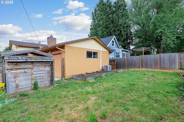 7430 N Burr Ave, Portland, OR 97203 - view of property exterior with a chimney, central AC unit, and an outdoor structure