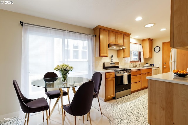 7430 N Burr Ave, Portland, OR 97203 - kitchen with white appliances, under cabinet range hood, a sink, light countertops, and recessed lighting