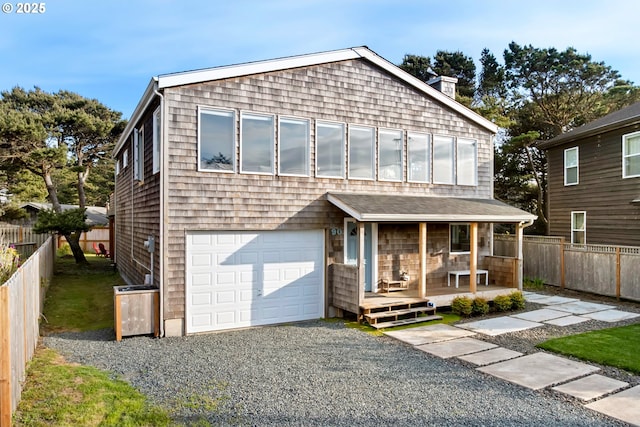 90 Beach Dr, Manzanita, OR 97130 - view of front facade with a garage, a porch, and driveway