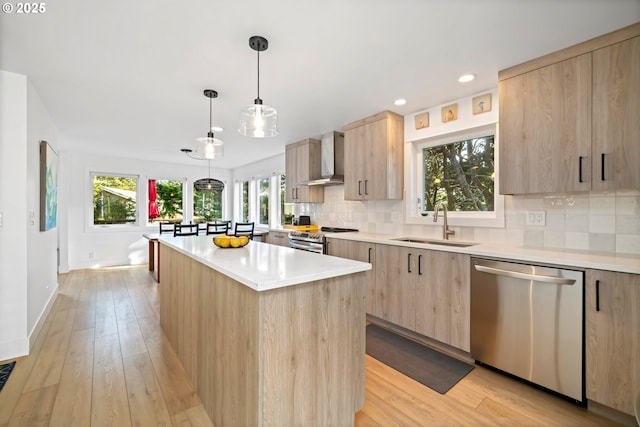 90 Beach Dr, Manzanita, OR 97130 - kitchen featuring appliances with stainless steel finishes, light brown cabinetry, modern cabinets, a center island, and backsplash