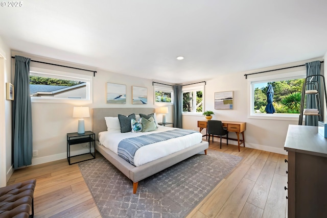 90 Beach Dr, Manzanita, OR 97130 - bedroom with light wood-style floors, multiple windows, and recessed lighting