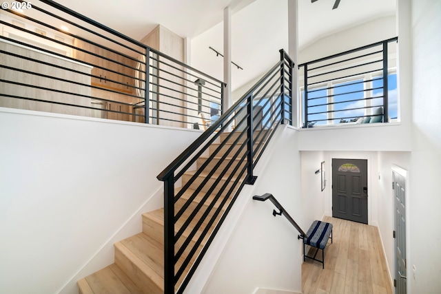 90 Beach Dr, Manzanita, OR 97130 - stairs featuring a towering ceiling and wood finished floors