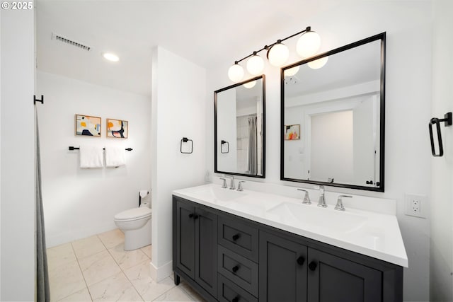 90 Beach Dr, Manzanita, OR 97130 - full bath featuring double vanity, marble look tiles, and recessed lighting