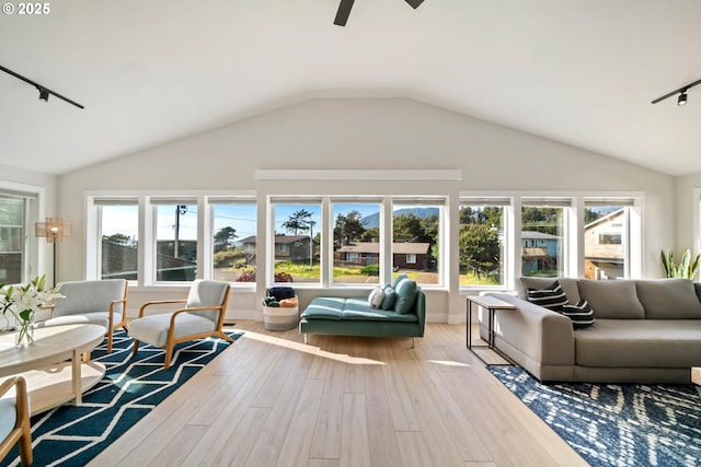 90 Beach Dr, Manzanita, OR 97130 - living room featuring plenty of natural light, hardwood / wood-style flooring, lofted ceiling, ceiling fan, and rail lighting