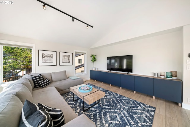 90 Beach Dr, Manzanita, OR 97130 - living area featuring lofted ceiling, light wood finished floors, and track lighting