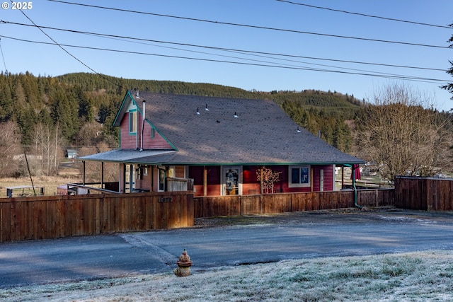 back of house featuring covered porch