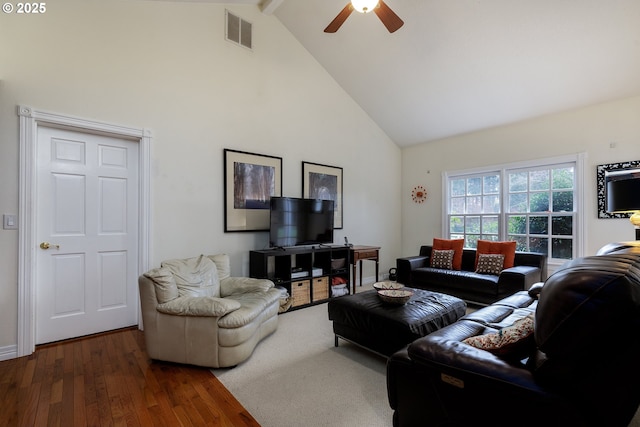 living room featuring beam ceiling, visible vents, a ceiling fan, wood finished floors, and high vaulted ceiling