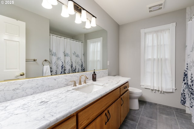 full bath with tile patterned flooring, toilet, a shower with shower curtain, vanity, and visible vents