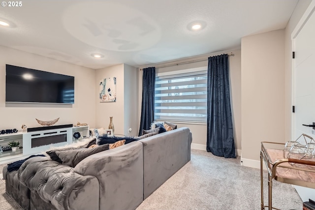 living room featuring carpet flooring, recessed lighting, and baseboards