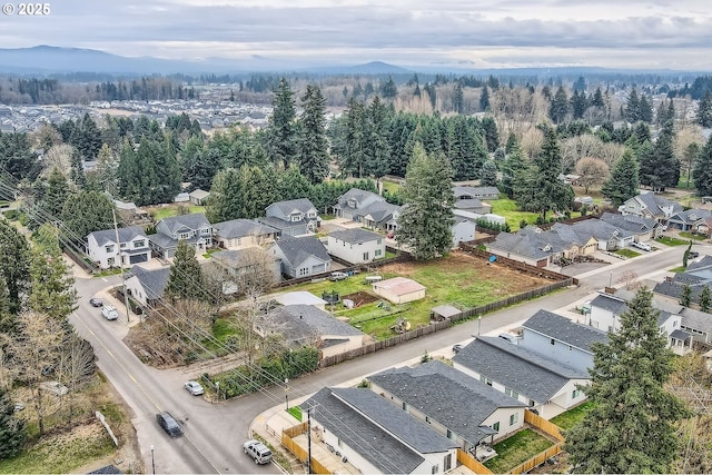 aerial view with a mountain view and a residential view