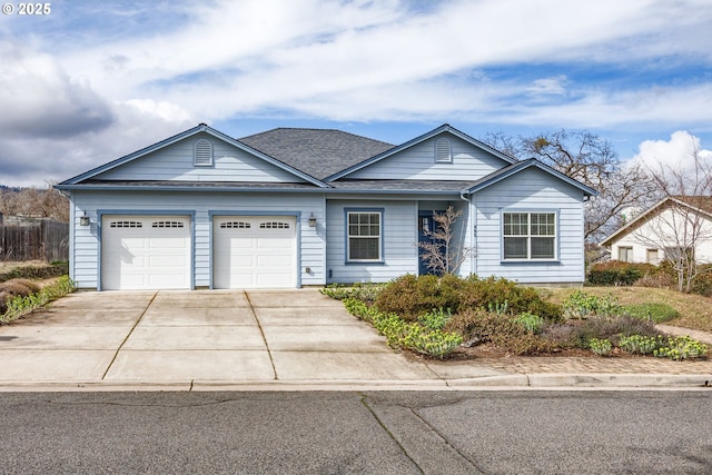 single story home featuring an attached garage, driveway, and a shingled roof