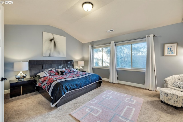 carpeted bedroom featuring vaulted ceiling