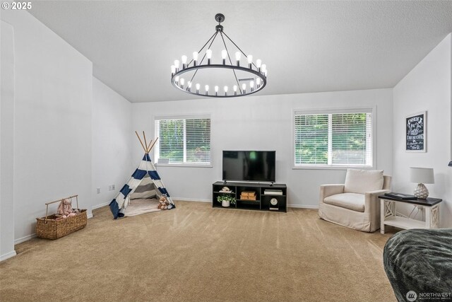 208 Salmonberry Ln, Longview, WA 98632 - living room featuring carpet flooring, a chandelier, and baseboards
