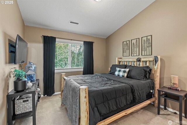 208 Salmonberry Ln, Longview, WA 98632 - bedroom with light carpet, a textured ceiling, baseboards, and vaulted ceiling
