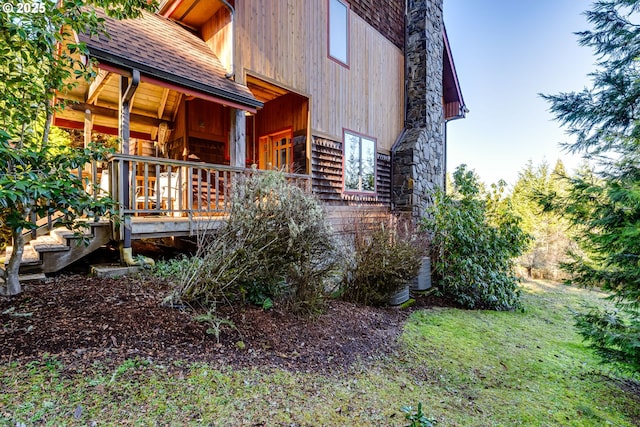 view of home's exterior featuring roof with shingles