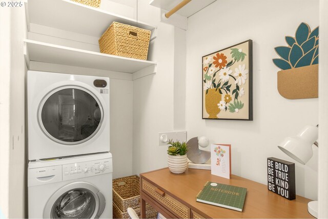 clothes washing area featuring stacked washer / dryer