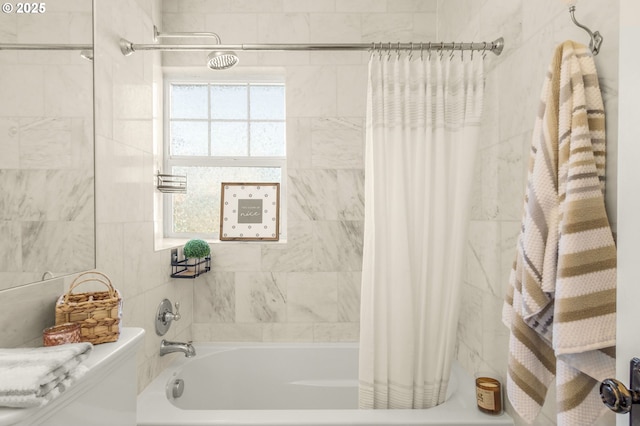 full bathroom featuring shower / bath combo with shower curtain and toilet