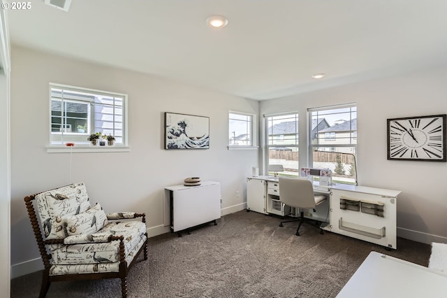 home office featuring dark colored carpet, recessed lighting, and baseboards