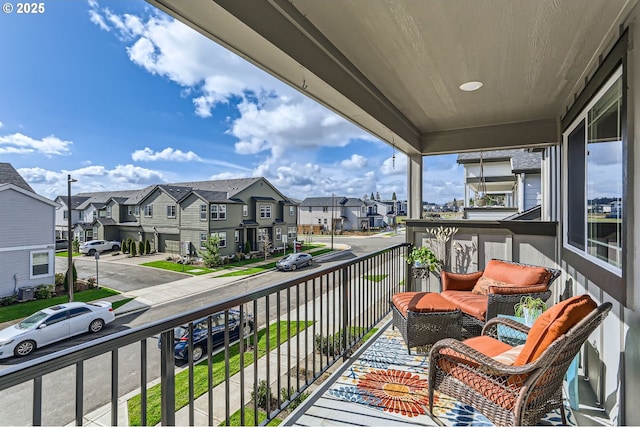 balcony with a residential view and cooling unit