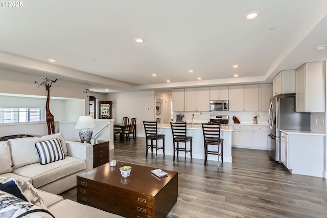 living area featuring recessed lighting and wood finished floors