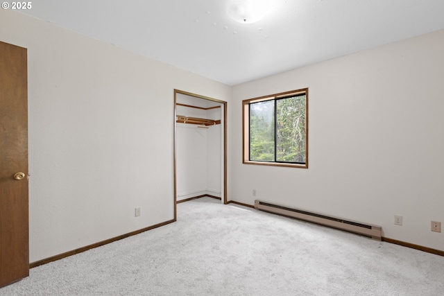 272 Whipple Tree Dr, Yoncalla, OR 97499 - unfurnished bedroom featuring baseboard heating, carpet floors, baseboards, and a closet