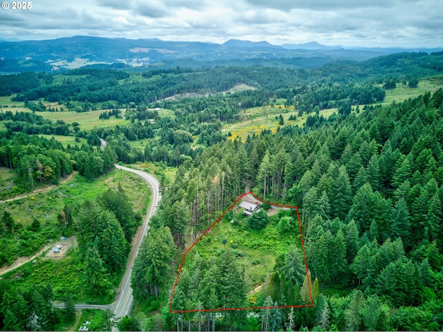 272 Whipple Tree Dr, Yoncalla, OR 97499 - aerial view of property and surrounding area with a heavily wooded area, property boundaries highlighted, and mountains