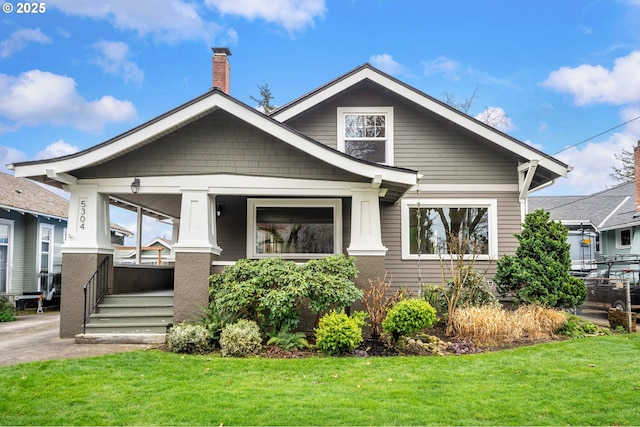 view of front of home featuring a porch and a front yard