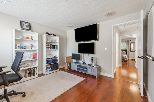 4880 SW Scholls Ferry Rd Unit 14, Portland, OR 97225 - office space featuring a textured ceiling, baseboards, attic access, and dark wood-type flooring