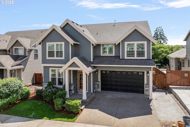 12241 Mimosa Way, Oregon City, OR 97045 - view of front of property with driveway, an attached garage, stone siding, and roof with shingles