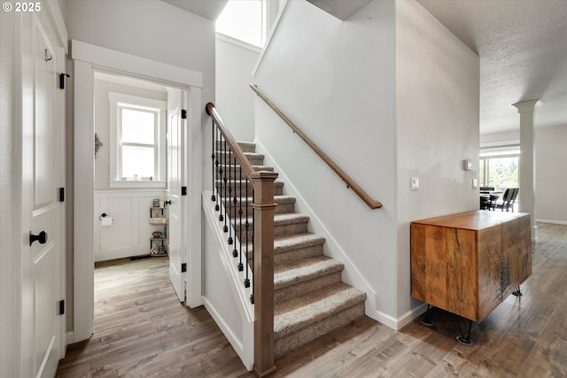 12241 Mimosa Way, Oregon City, OR 97045 - stairway with wood finished floors and a textured ceiling
