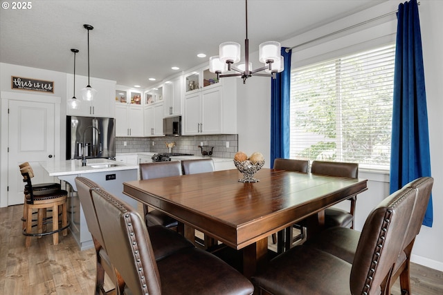 12241 Mimosa Way, Oregon City, OR 97045 - dining area featuring a chandelier, light wood finished floors, and recessed lighting