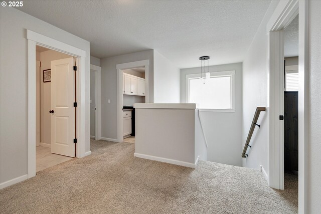 12241 Mimosa Way, Oregon City, OR 97045 - corridor with an upstairs landing, light carpet, and a textured ceiling