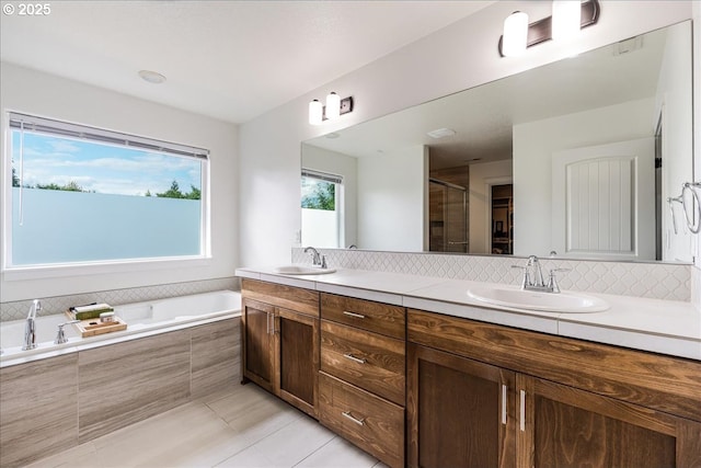 2341 Turnbull Ct, Forest Grove, OR 97116 - bathroom with double vanity, a garden tub, tile patterned flooring, a shower stall, and decorative backsplash