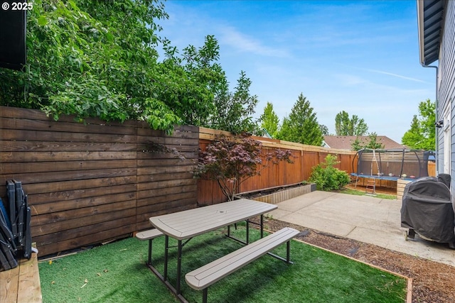 2341 Turnbull Ct, Forest Grove, OR 97116 - fenced backyard with a trampoline and a patio