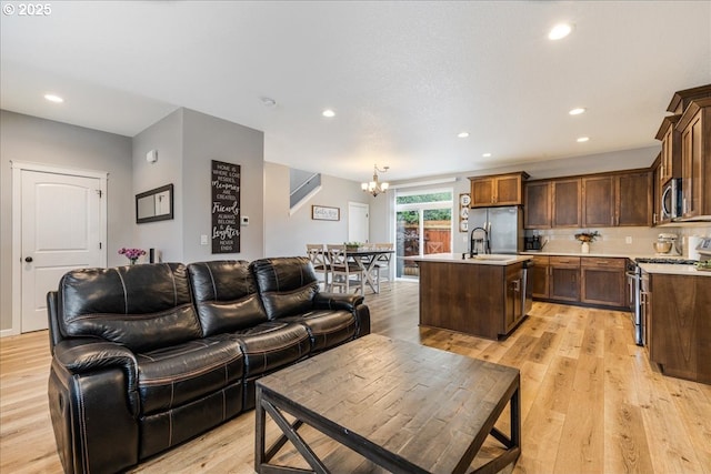 2341 Turnbull Ct, Forest Grove, OR 97116 - living area featuring a chandelier, recessed lighting, and light wood-style flooring