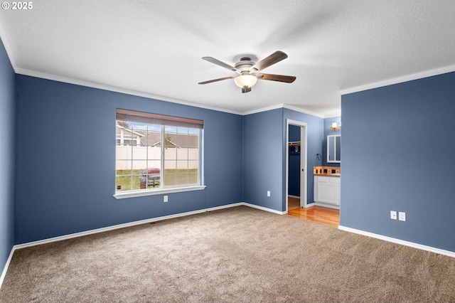 unfurnished bedroom featuring baseboards and light carpet